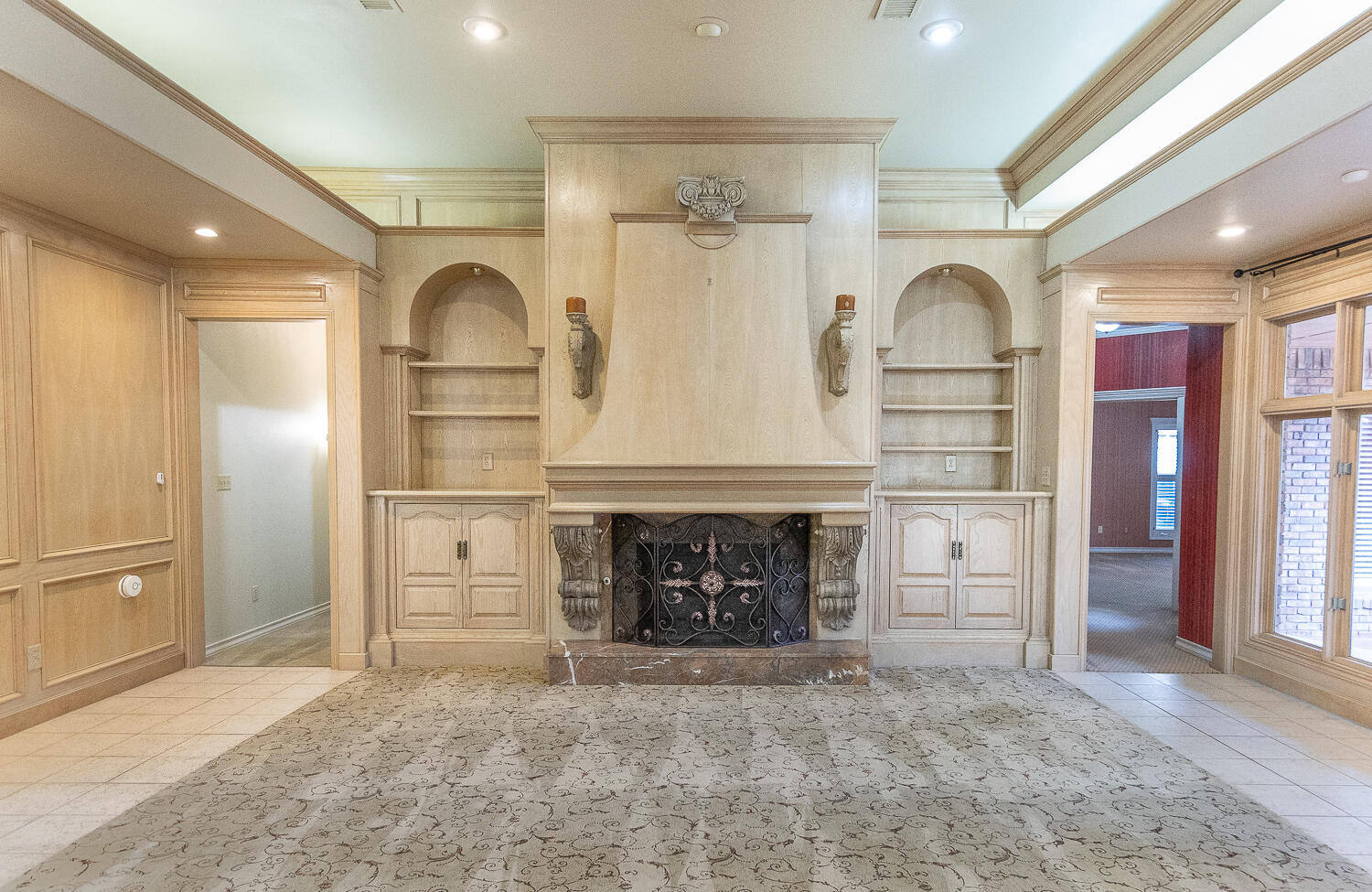 6604 3rd Street Lubbock, TX 79416 - Photo 6 of 46 an empty room with fireplace and cabinet