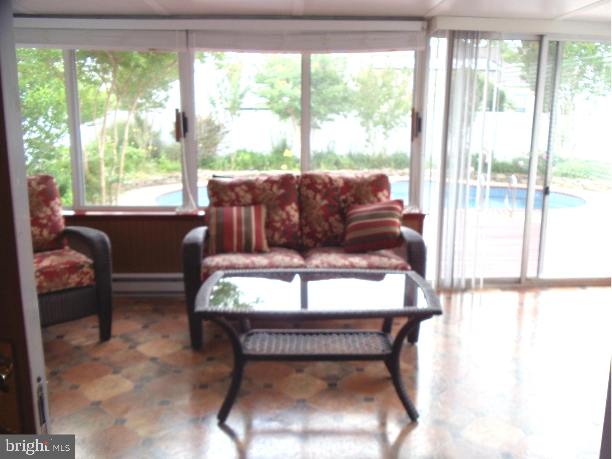 180 Chelsea Road Pasadena, MD 21122 - Photo 21 of 30 Wonderful Sun Room overlooking the pool!
