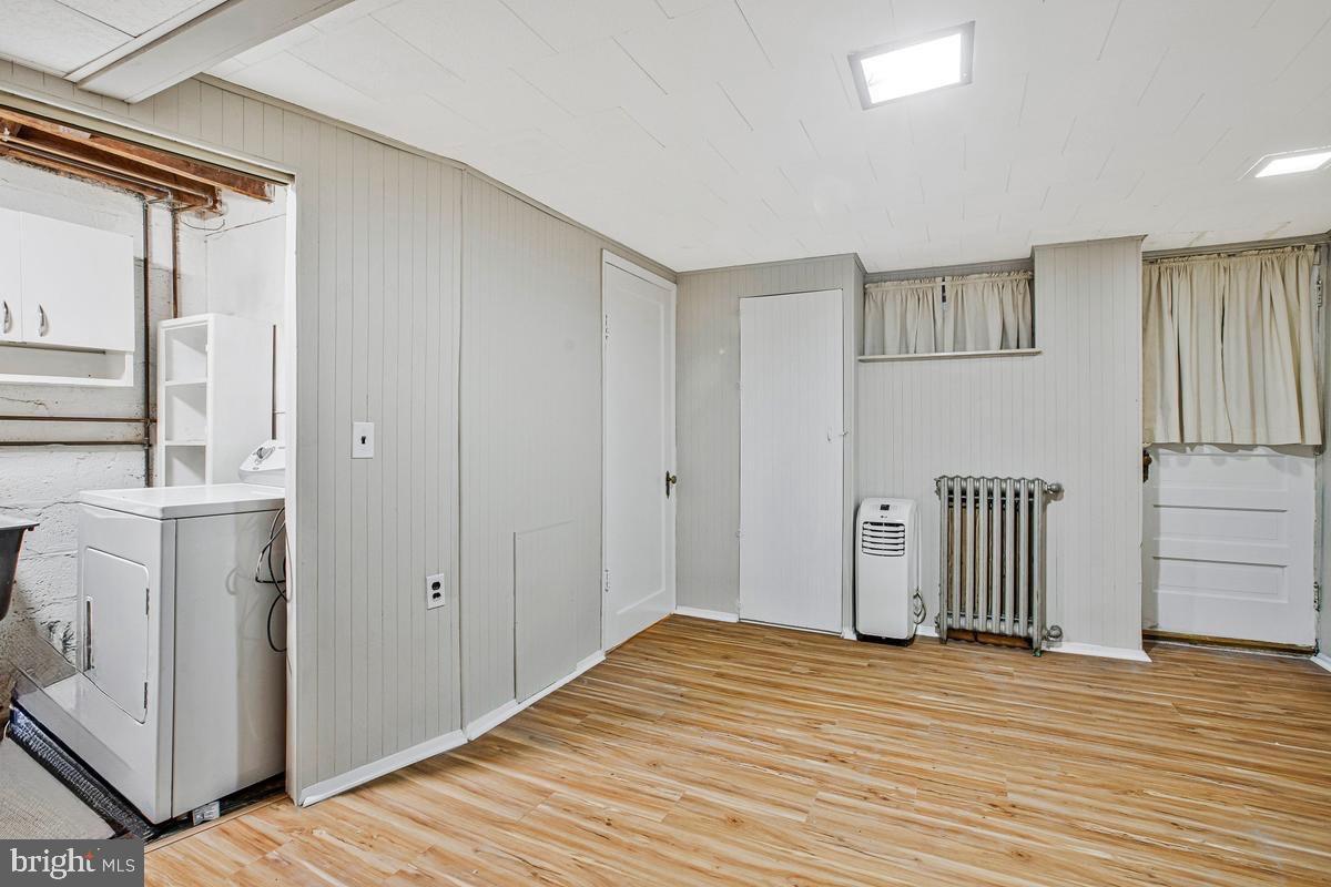 3040 Federal Street Baltimore, MD 21213 - Photo 32 of 41 a view of a livingroom with wooden floor and cabinet