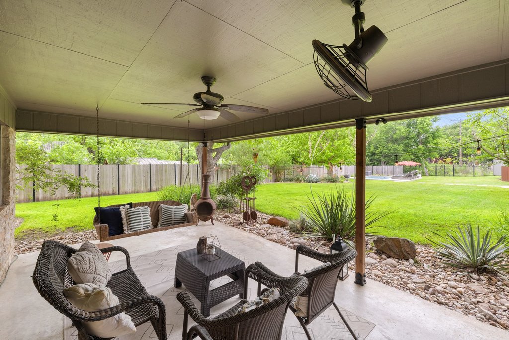 302 South Schramm Road Granger, TX 76530 - Photo 24 of 33 a view of a patio with a table chairs and a backyard