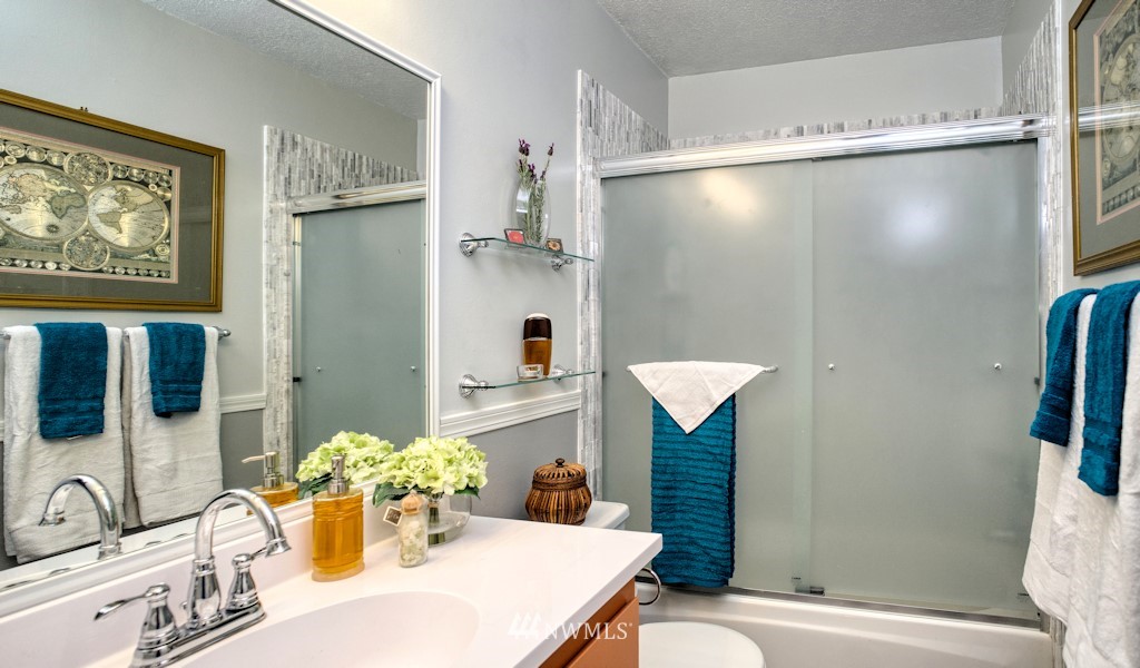 8401 25th Avenue Southwest, Unit B Seattle, WA 98106 - Photo 8 of 10 a bathroom with a sink toilet and shower
