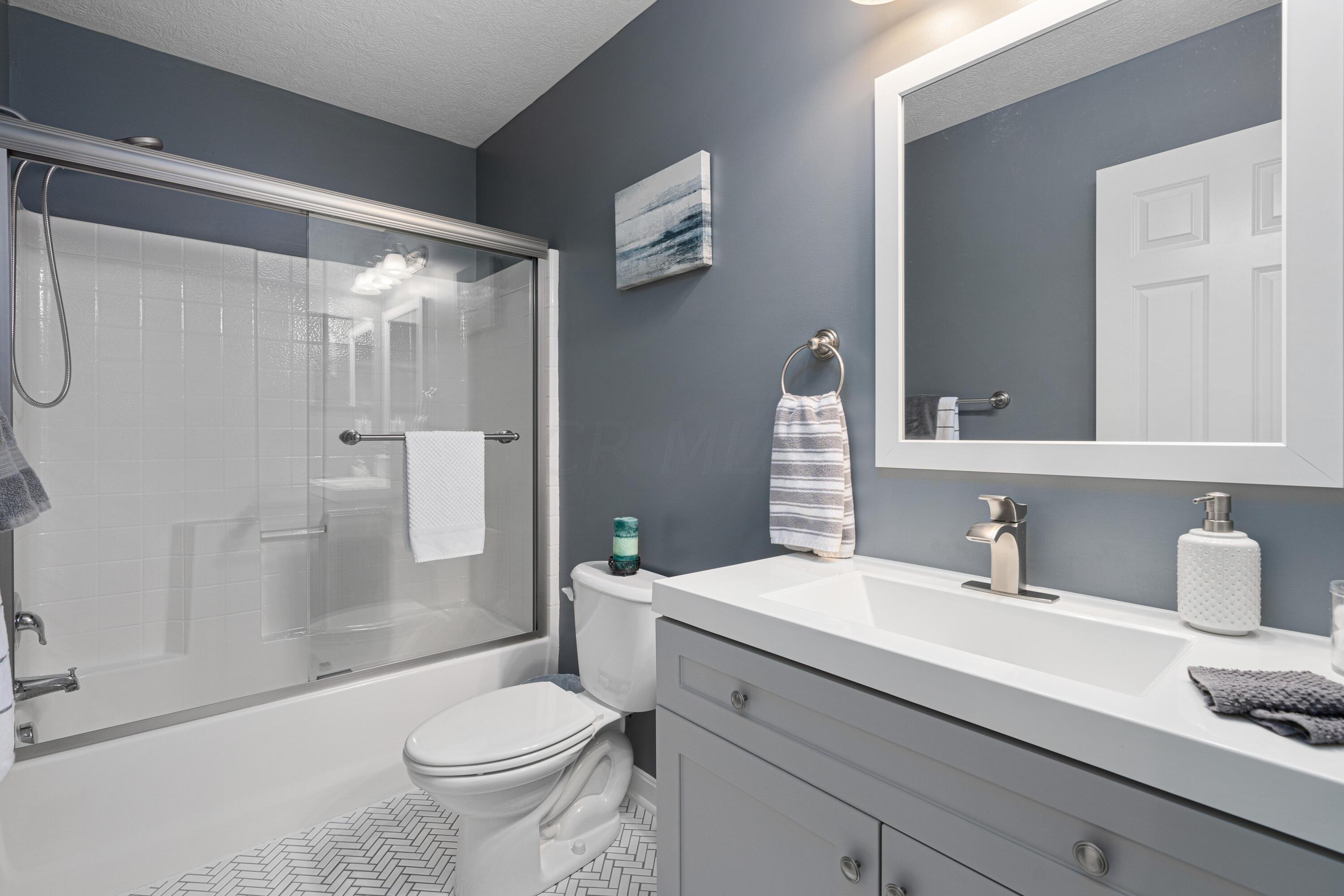 6056 Heckert Road Columbus, OH 43081 - Photo 34 of 42 Hall Bath. Chevron Tile Floor.