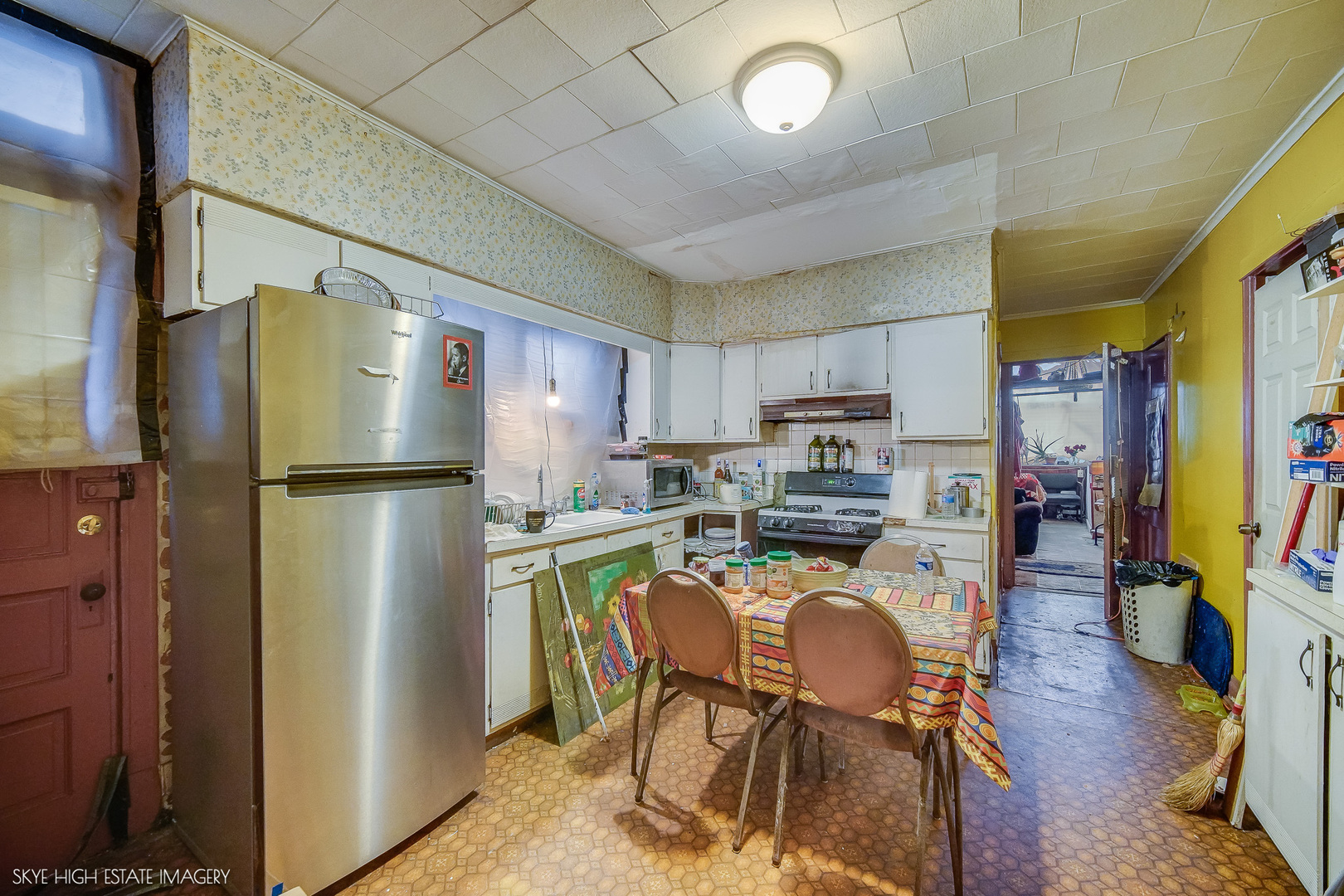 2016 West 51st Street Chicago, IL 60609 - Photo 7 of 14 a kitchen with stainless steel appliances granite countertop a refrigerator and a stove top oven