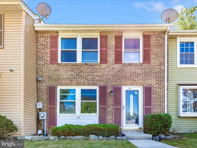 a view of brick building with a yard