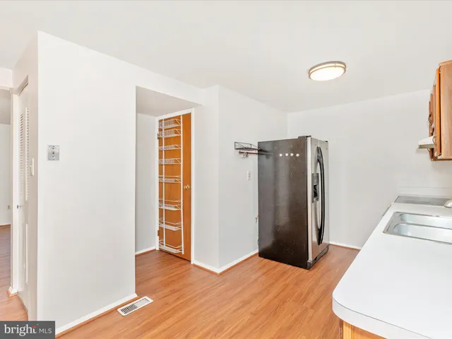a view of a room with wooden floor and closet