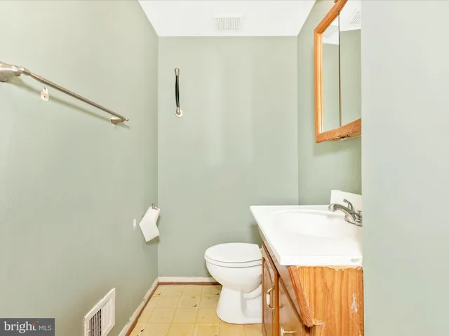a bathroom with a toilet and a sink