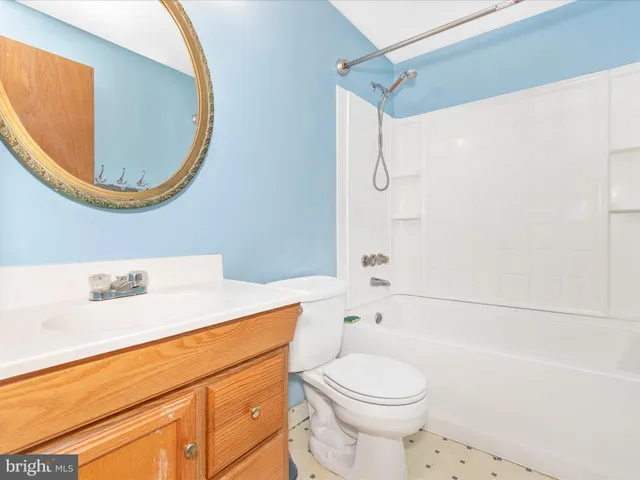 a bathroom with a sink a toilet and a bathtub
