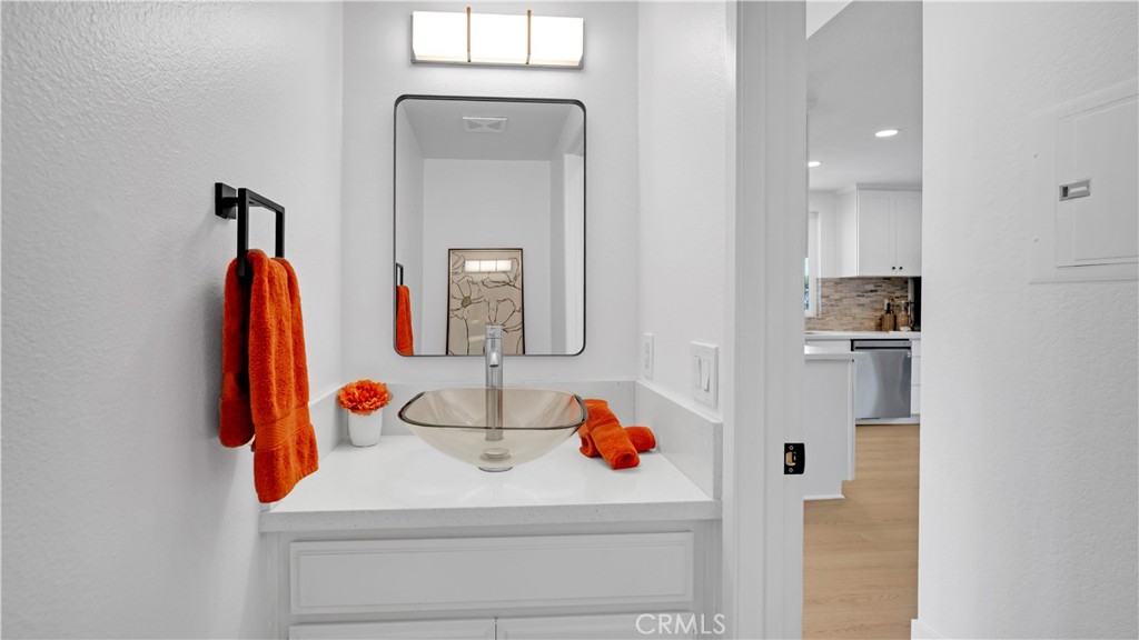 336 Fallingstar Irvine, CA 92614 - Photo 18 of 73 a bathroom with a sink and a mirror