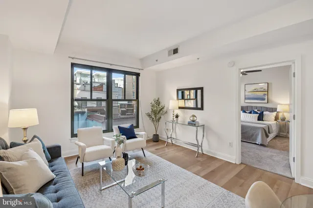 a living room with furniture and a window