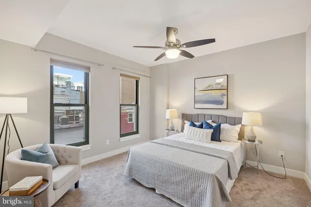 a bedroom with a bed and a couch