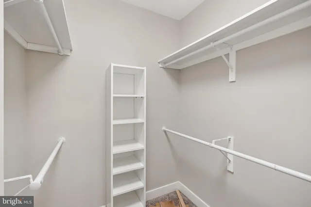 a view of an empty walk in closet