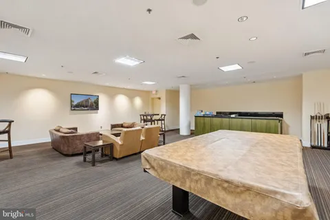 a bed room with furniture and wooden floor