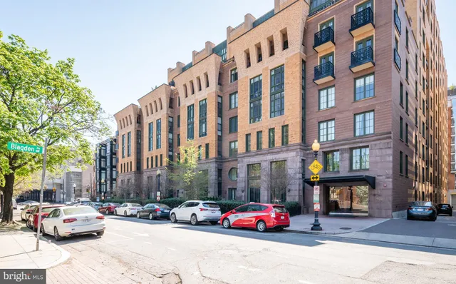 a cars parked in front of brick building