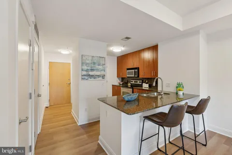 a kitchen with a table and chairs in it