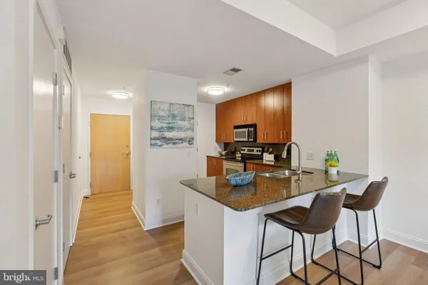 a kitchen with a table and chairs in it