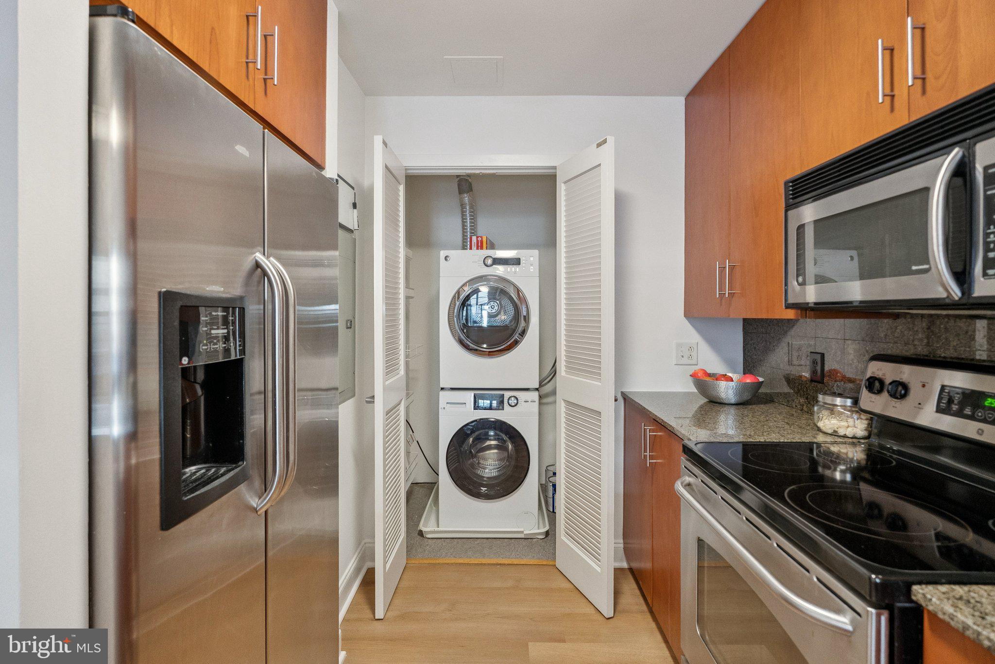 910 M Street Northwest, Unit 202 Washington, DC 20001 - Photo 6 of 27 a kitchen with stainless steel appliances granite countertop a sink and a stove top oven
