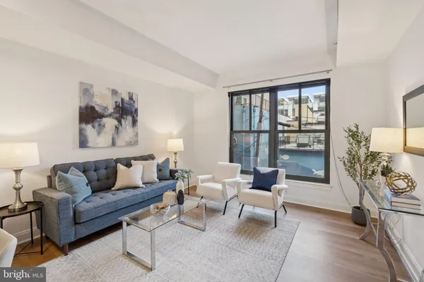 a living room with furniture and a large window