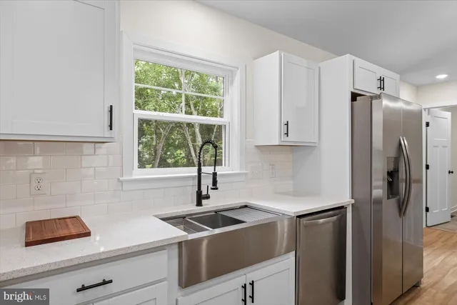 a kitchen with a sink and a window