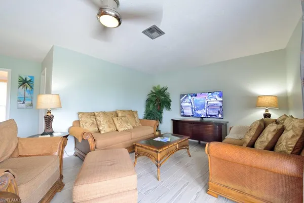 a living room with furniture and a couch