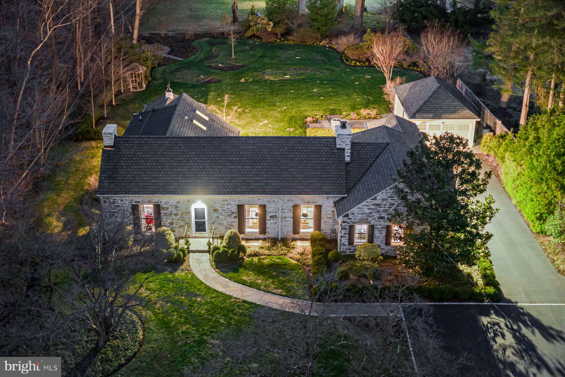 an aerial view of house with yard swimming pool and outdoor seating