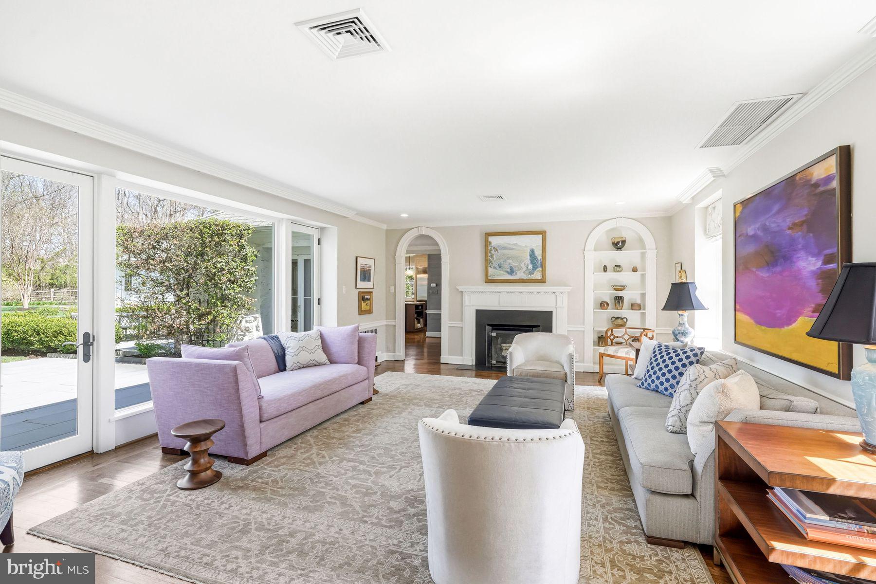 828 Black Rock Road Gladwyne, PA 19035 - Photo 16 of 68 a living room with furniture a rug potted plant and a large window