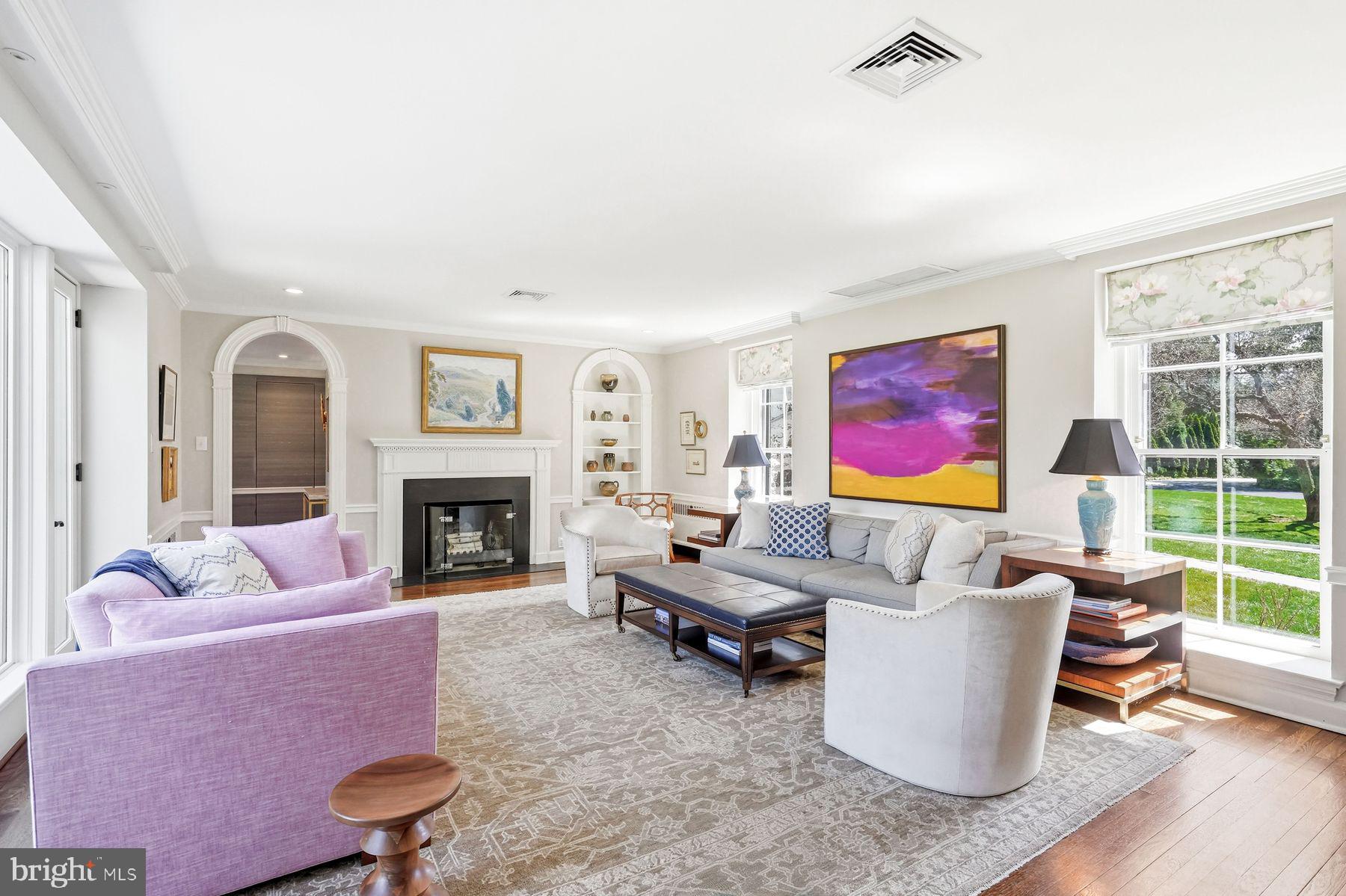 828 Black Rock Road Gladwyne, PA 19035 - Photo 17 of 68 a living room with furniture a fireplace and a large window