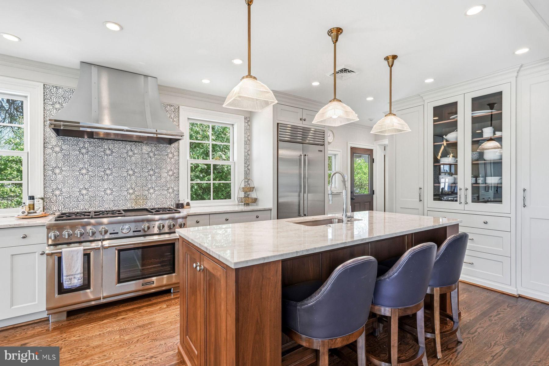 828 Black Rock Road Gladwyne, PA 19035 - Photo 27 of 68 a kitchen with a stove a window and chairs