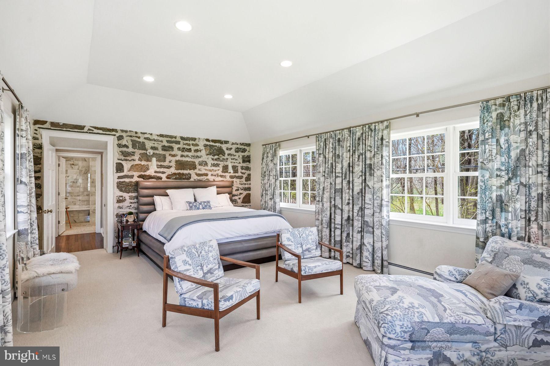 828 Black Rock Road Gladwyne, PA 19035 - Photo 37 of 68 a bedroom with a bed and wooden floor