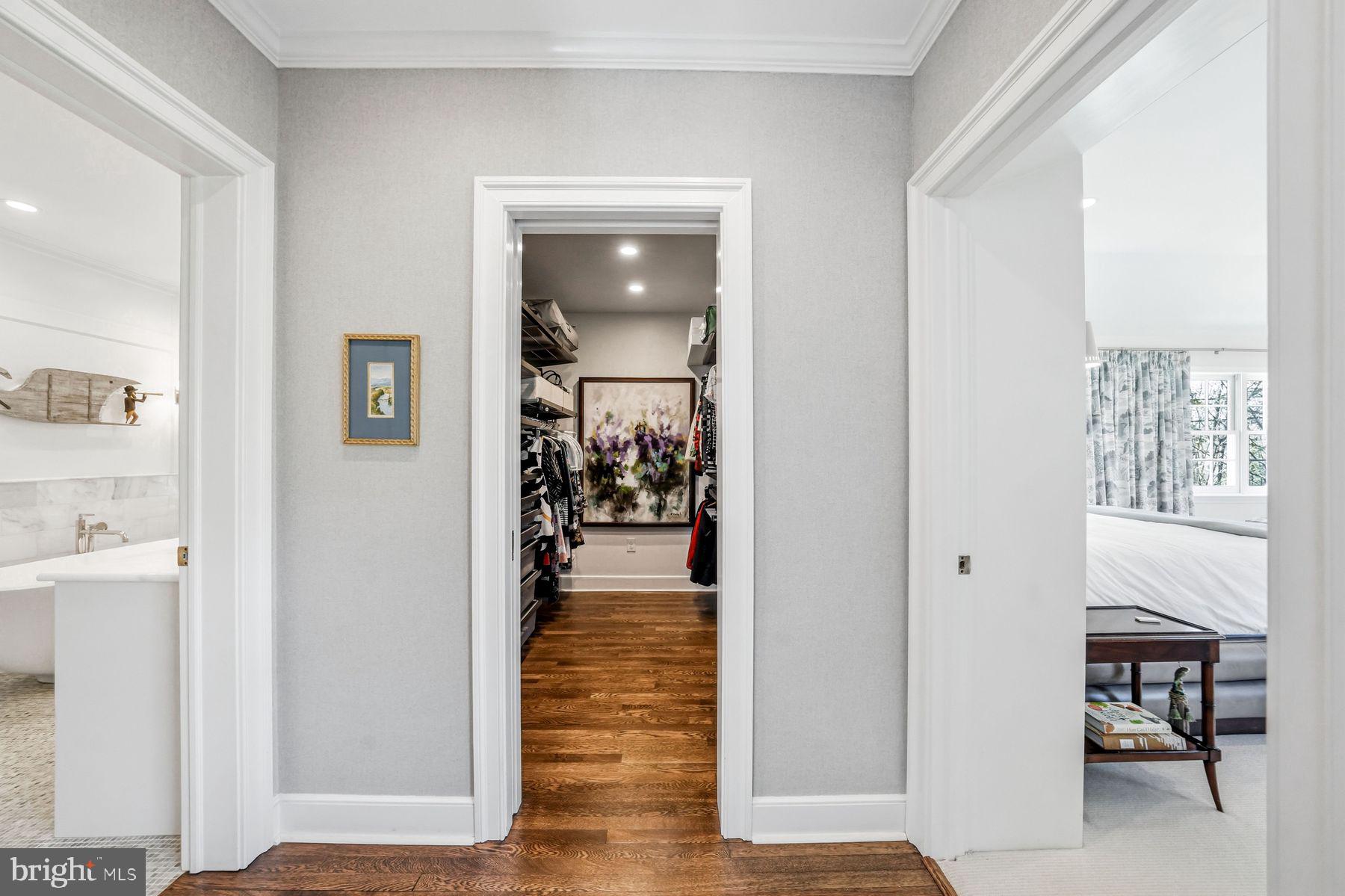 828 Black Rock Road Gladwyne, PA 19035 - Photo 42 of 68 a view of a hallway with dining room and wooden floor