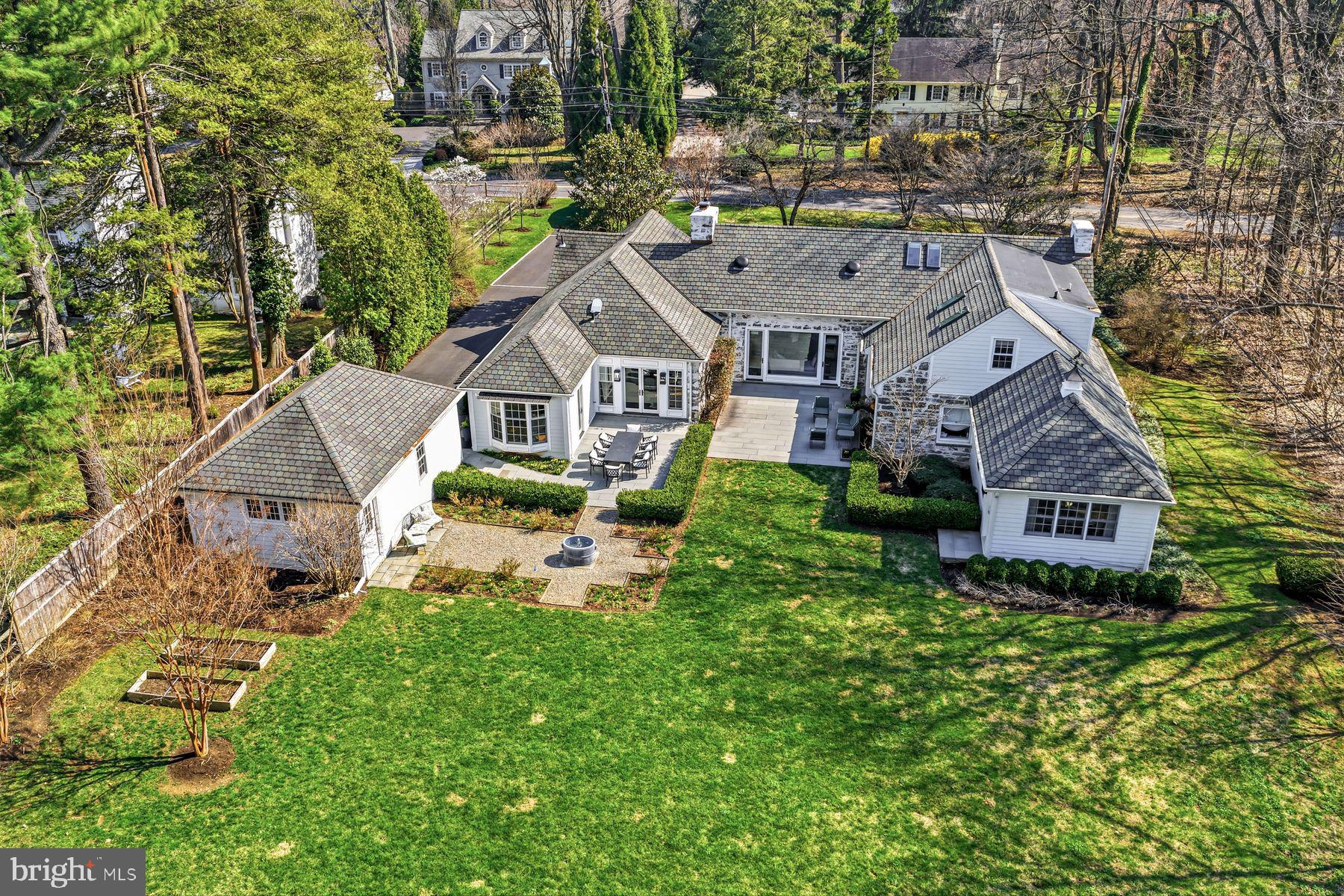 828 Black Rock Road Gladwyne, PA 19035 - Photo 59 of 68 an aerial view of a house with a big yard and large trees