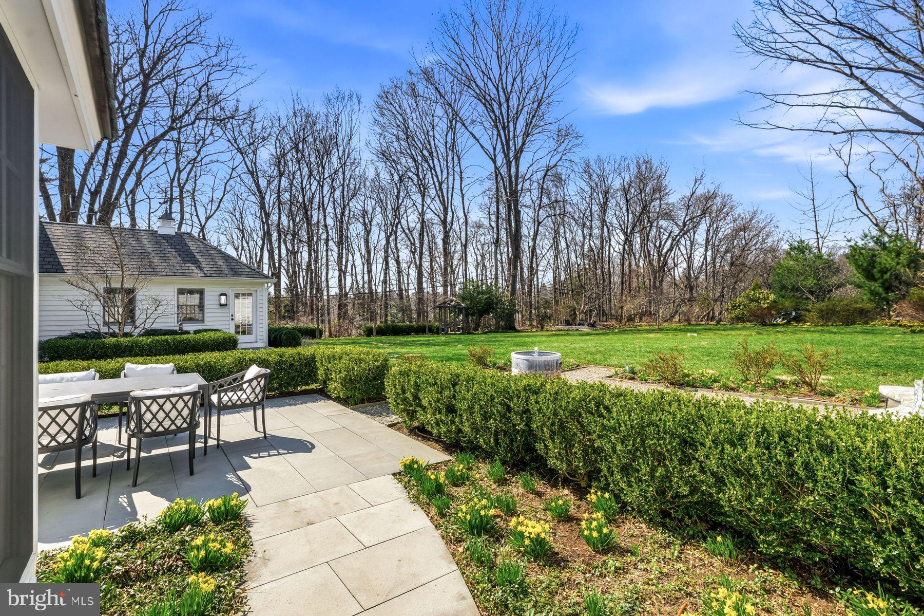 828 Black Rock Road Gladwyne, PA 19035 - Photo 61 of 68 a patio with a yard table and chairs