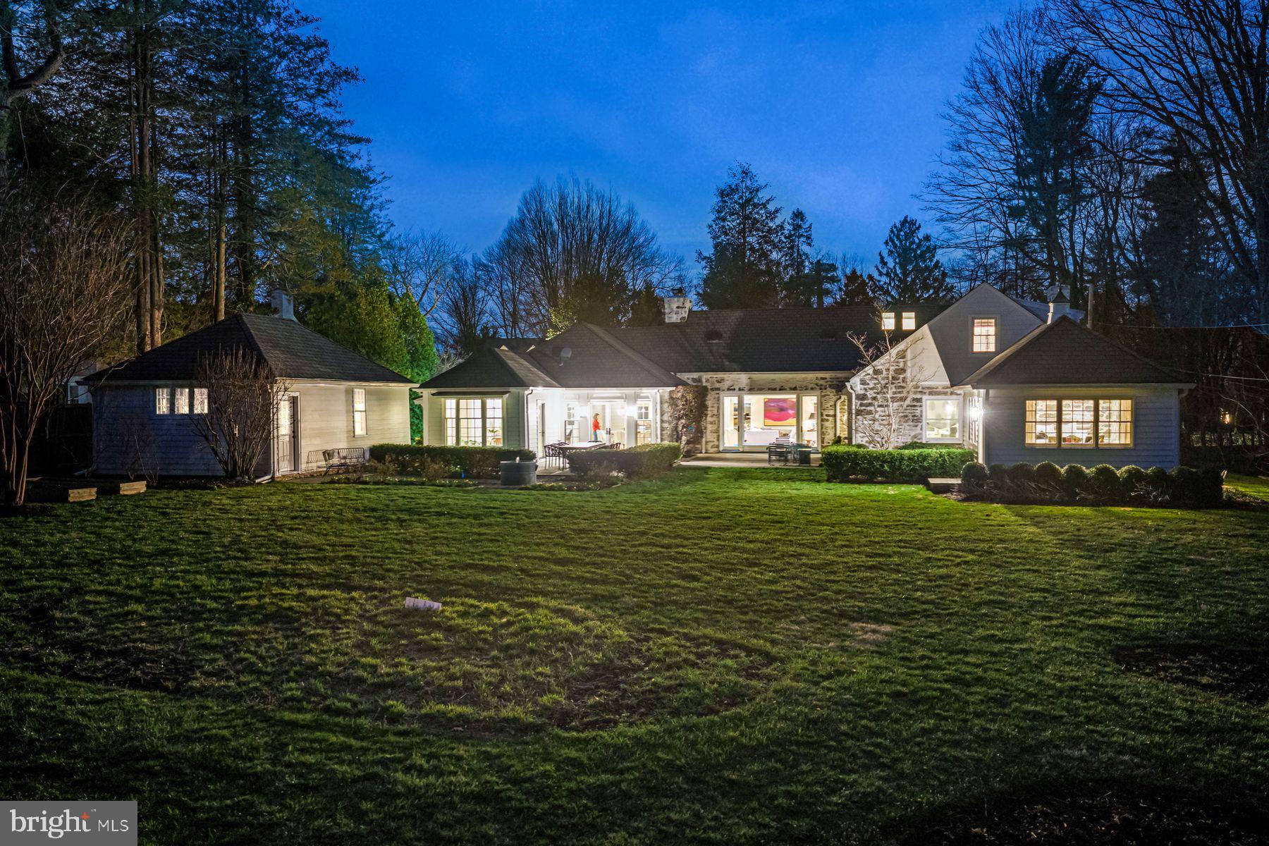 828 Black Rock Road Gladwyne, PA 19035 - Photo 7 of 68 a front view of a house with a garden