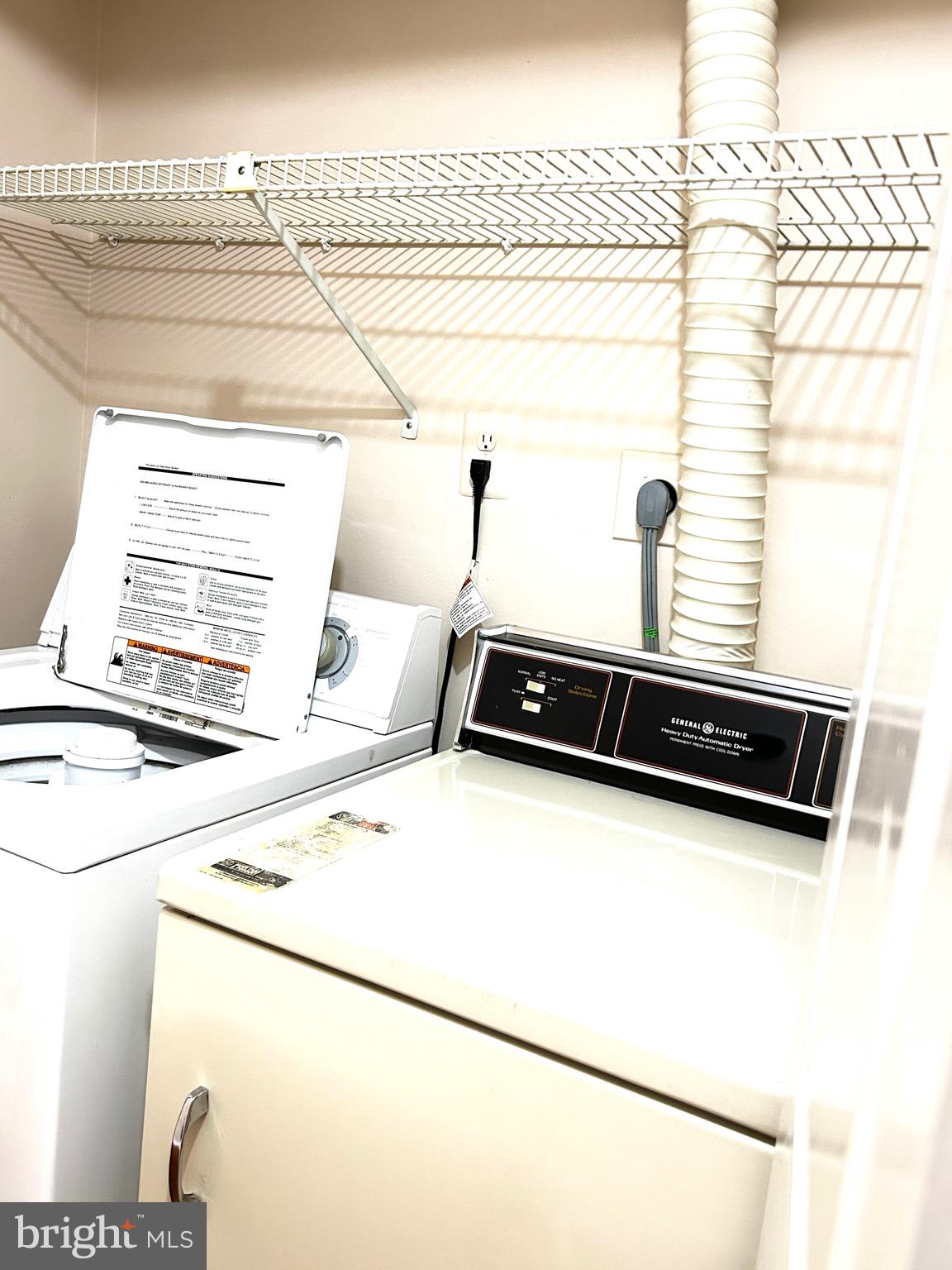 803 J Stratford Way, Unit 1100J Frederick, MD 21701 - Photo 11 of 16 a close up of a sink a stove and a refrigerator