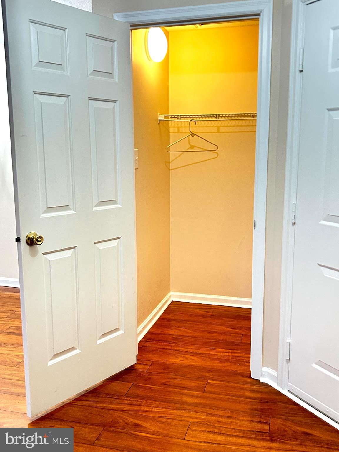 803 J Stratford Way, Unit 1100J Frederick, MD 21701 - Photo 15 of 16 a view of a room with wooden floor and a window