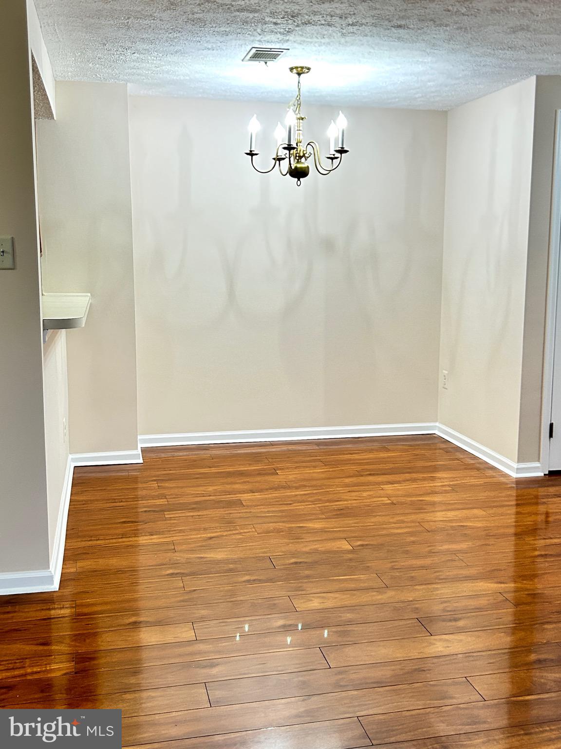803 J Stratford Way, Unit 1100J Frederick, MD 21701 - Photo 4 of 16 a view of empty room with wooden floor