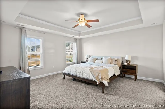 a spacious bedroom with a bed and a window