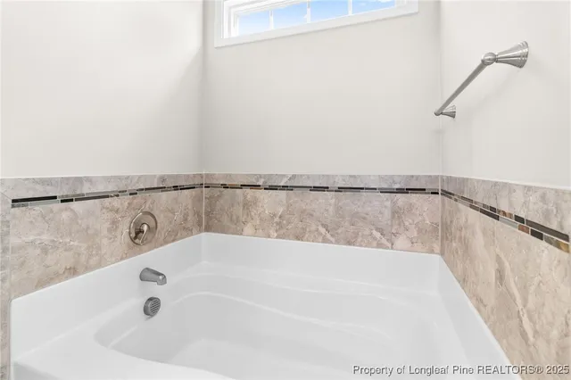 a view of a bathtub in a bathroom