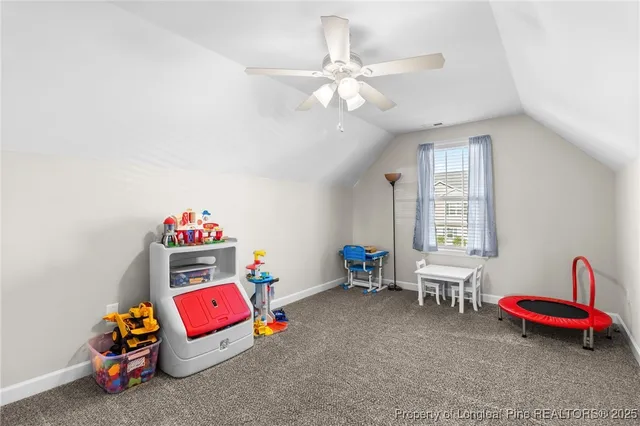 a bedroom with furniture and a chandelier