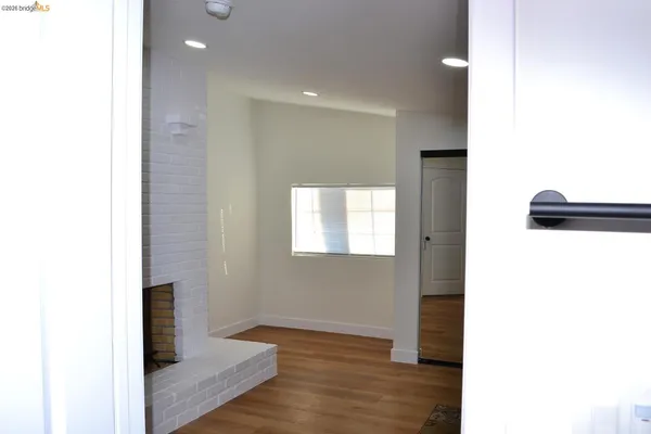 a view of hallway with wooden floor