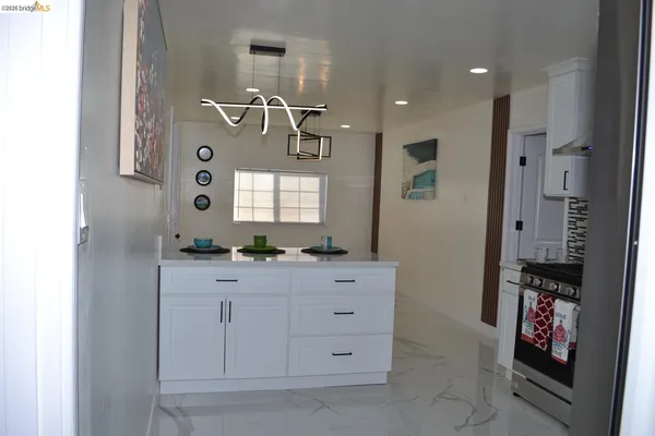 a bathroom with a sink a mirror and a shower