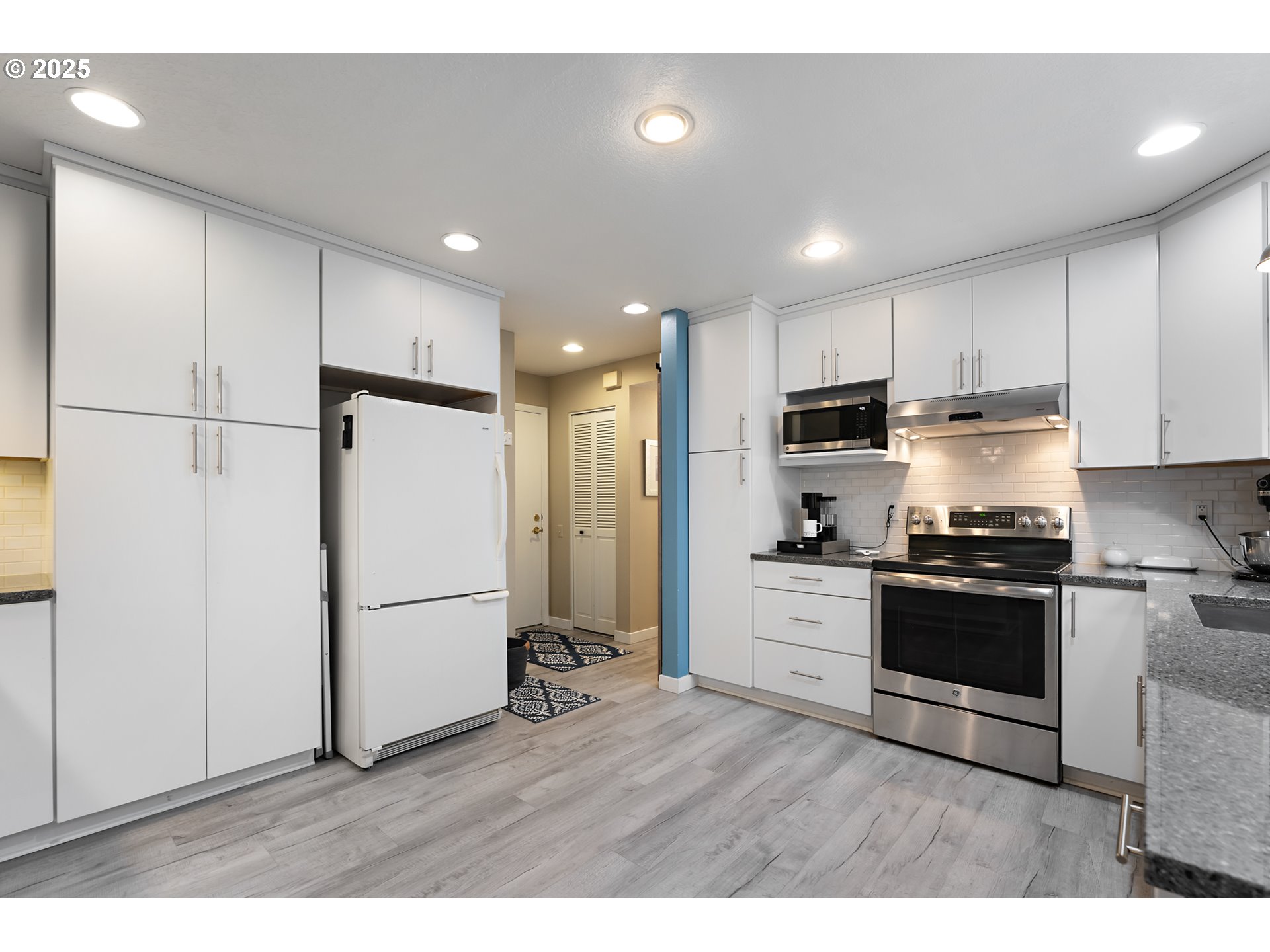 15514 Southwest 114th Court, Unit 61 Tigard, OR 97224 - Photo 12 of 35 a kitchen with refrigerator and cabinets