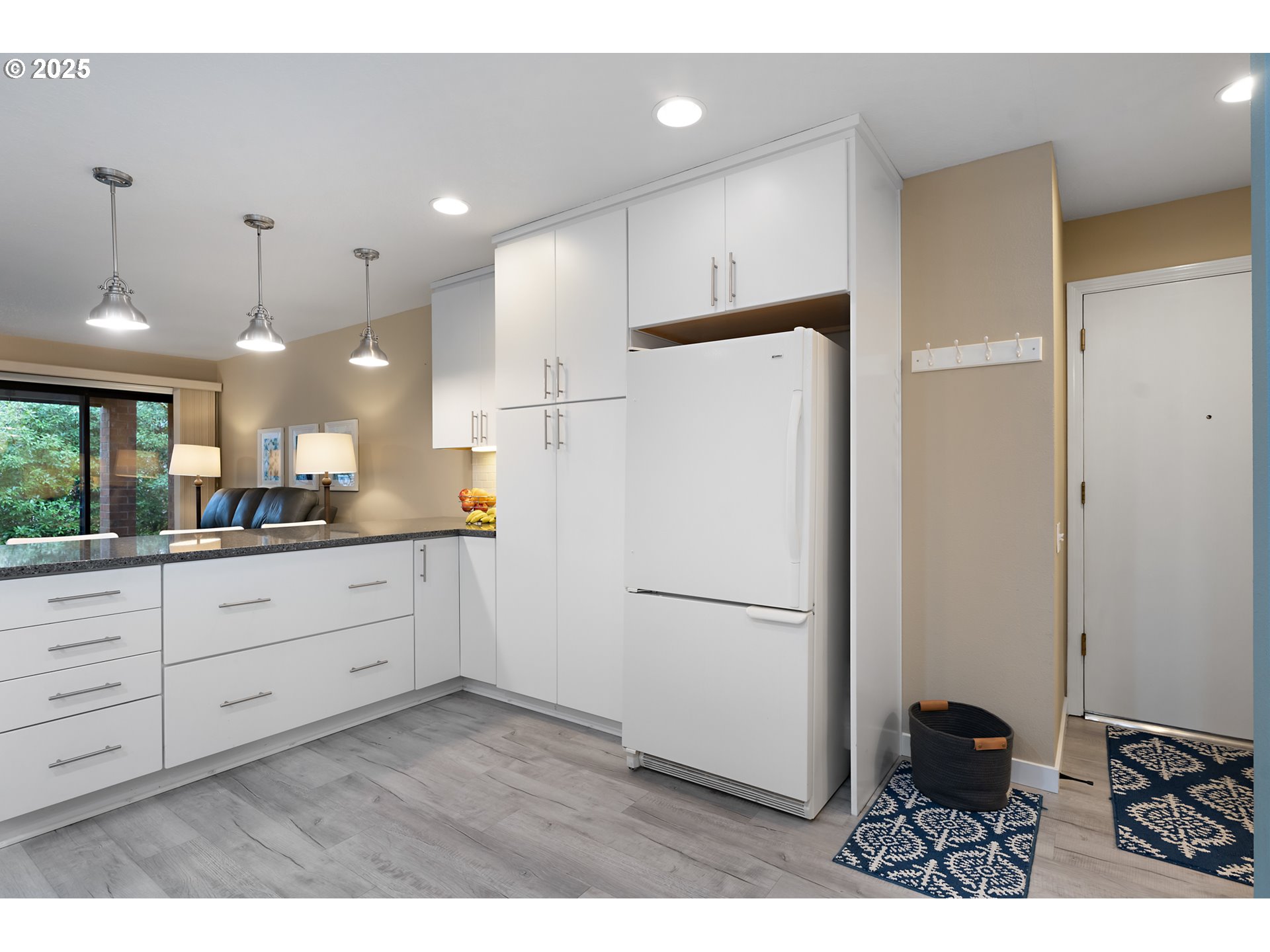 15514 Southwest 114th Court, Unit 61 Tigard, OR 97224 - Photo 15 of 35 a kitchen with sink cabinets and refrigerator