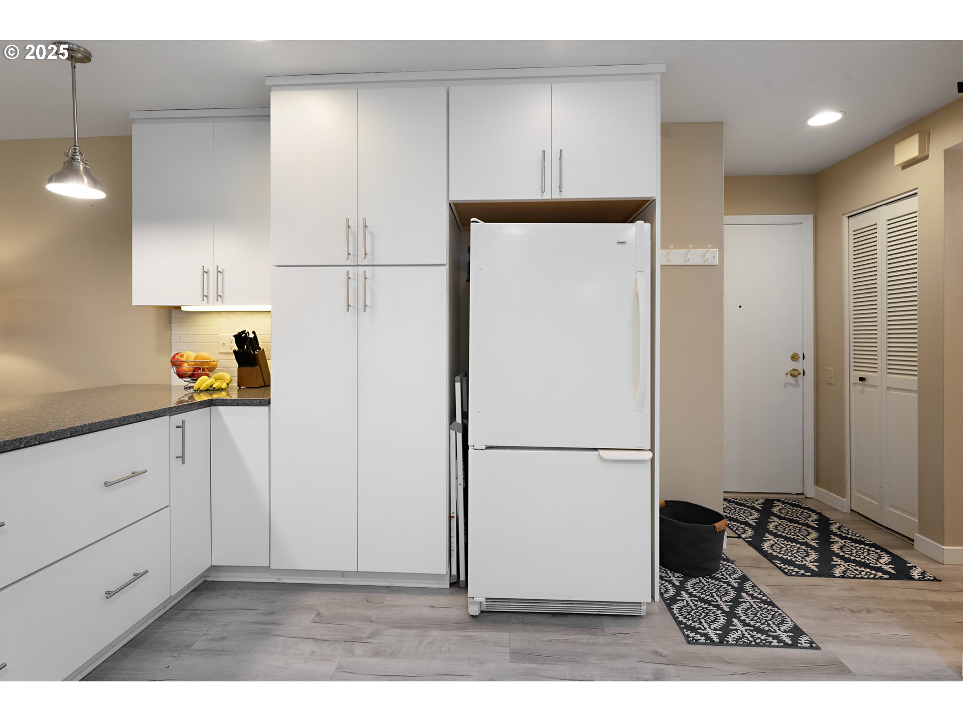 15514 Southwest 114th Court, Unit 61 Tigard, OR 97224 - Photo 16 of 35 a kitchen with a refrigerator and a stove