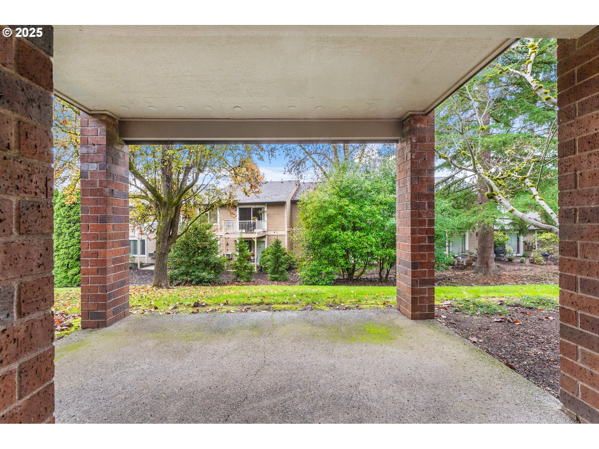 15514 Southwest 114th Court, Unit 61 Tigard, OR 97224 - Photo 26 of 35 a backyard of a house with a yard and outdoor seating