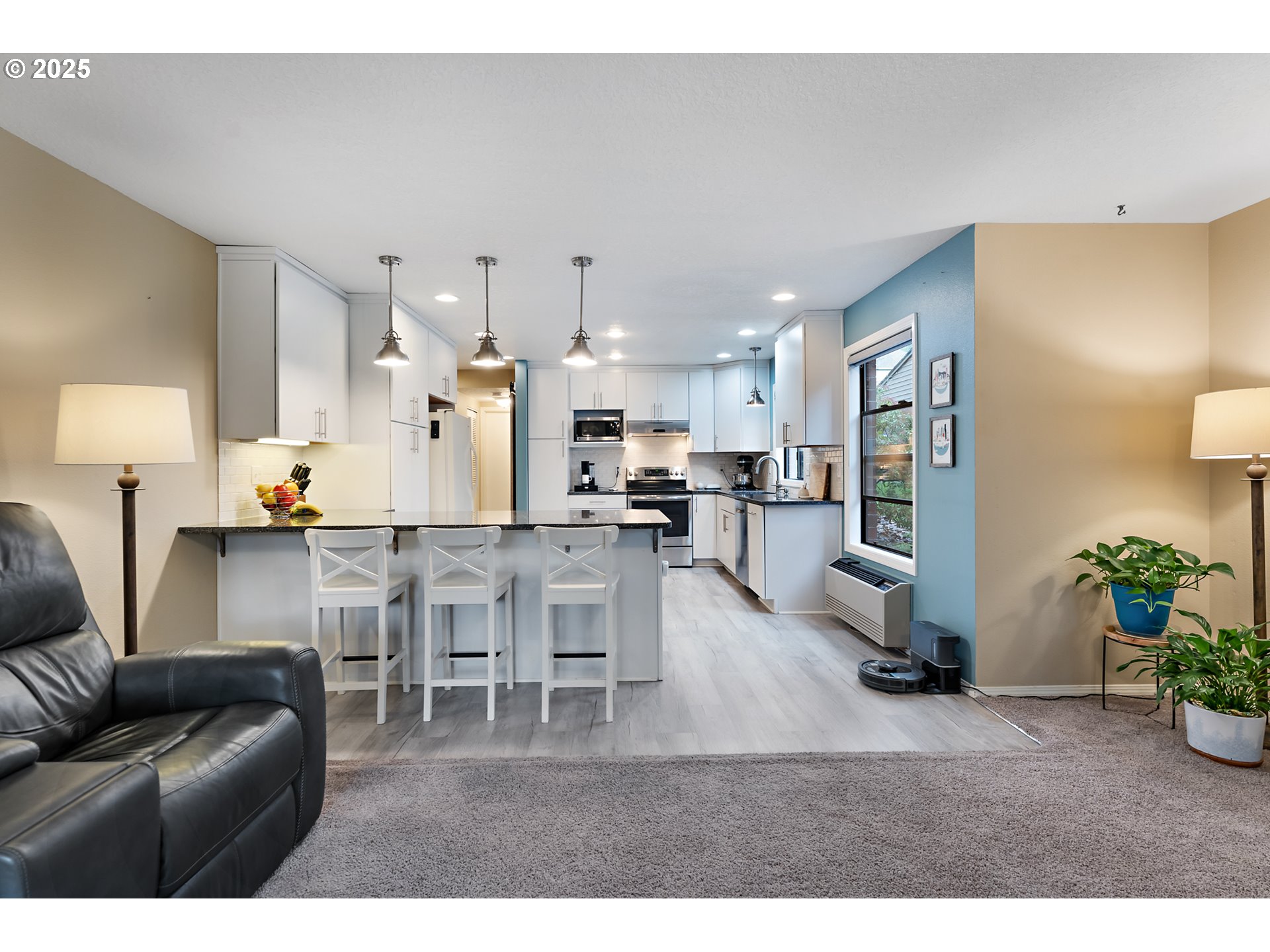 15514 Southwest 114th Court, Unit 61 Tigard, OR 97224 - Photo 8 of 35 a living room with furniture and kitchen view
