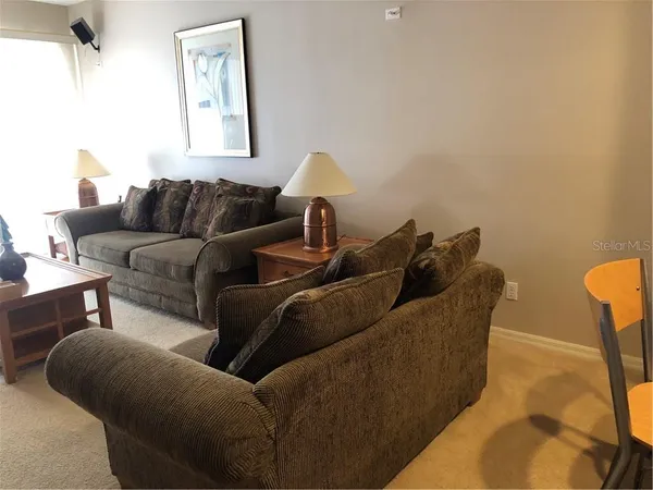 a living room with furniture and a window