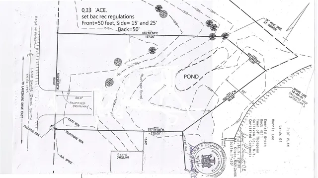 a view of a yard with a tree