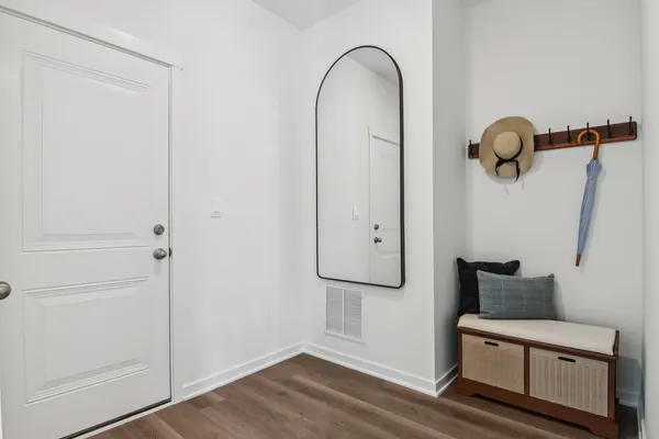 a view of entryway with wooden floor