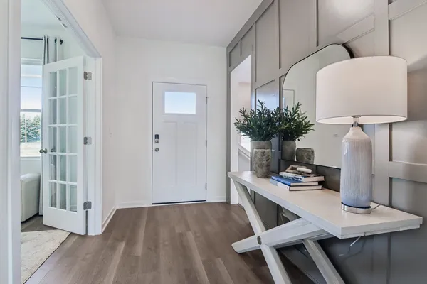 a view of kitchen with cabinets and wooden floor