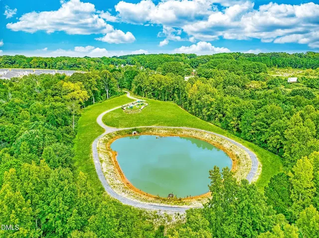 a view of a swimming pool with a yard
